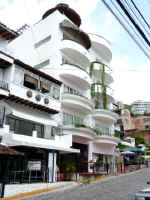 view of andales condo building AND on olas altas street