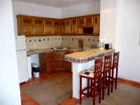 condominium kitchen area and breakfast bar