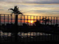 sunset from balcony , some of pool/terrace area visible