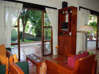 living area looking onto patio terrace