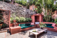 outside patio with tropical gardens