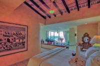master bedroom with sitting area and views of Vallarta and Banderas Bay
