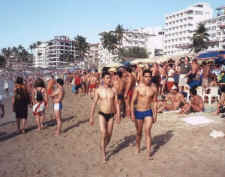 handsome mexican dudes strolling along the seashore