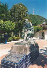 Statue of director and screen-writer John Huston on the Cuale river island