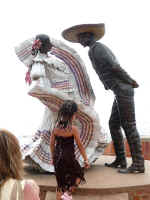 xiutla dancers sculpture on the new malecn