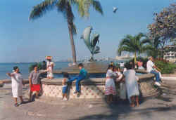 puerto vallarta tourism tourist information - Friendship fountain with dolphins by James Bottoms donated by Santa Barbara